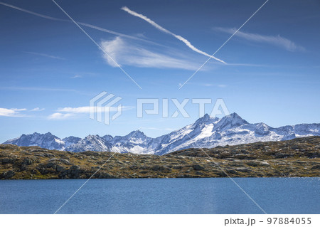Alpine Lake at Oberalp Pass in Graubunden alps, Grisons, Switzerland Alpine Lake at Oberalp Pass in Graubunden alps, Grisons, Switzerland 97884055