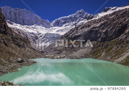 Llaca lake in Cordillera Blanca with snowcapped Andes, Ancash, Peru 97884260