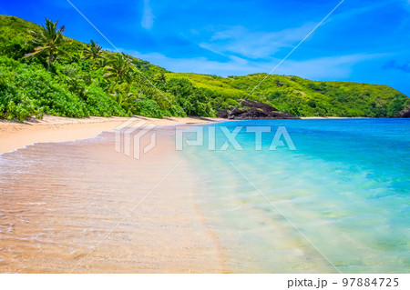 Tropical sandy beach at summer day in Fiji Islands, Pacific ocean Tropical sandy beach at summer day in Fiji Islands, Pacific ocean 97884725