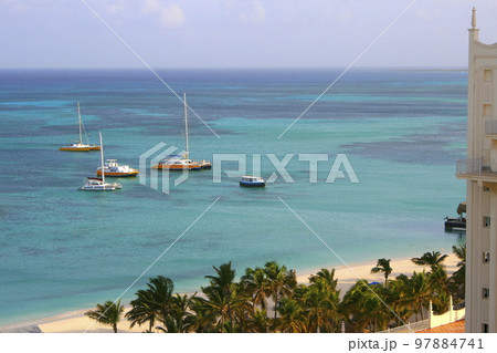 Secluded turquoise beach in Aruba, Caribbean Blue sea, Duth Antilles Secluded turquoise beach in Aruba, Caribbean Blue sea, Duth Antilles 97884741