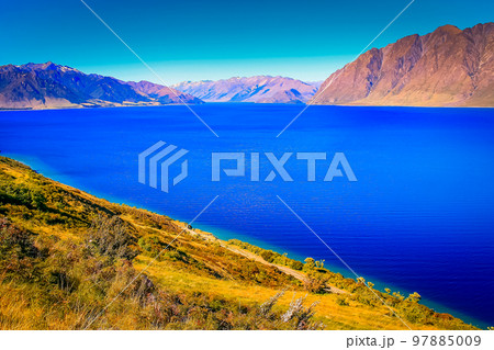 Lake Wakatipu coastline in south New Zealand, near Queenstown Lake Wakatipu coastline in south New Zealand, near Queenstown 97885009