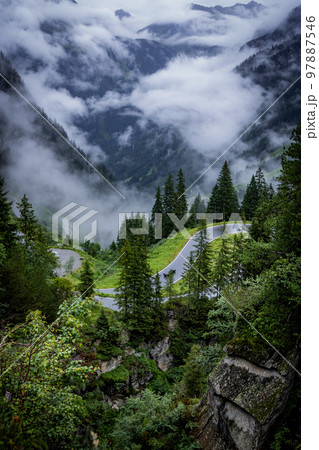 Beautiful view over the mountains and fir trees in the Austrian Alps 97887546