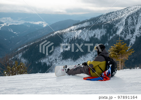 man snowboarder with slovakia flag at ski resort slope 97891164