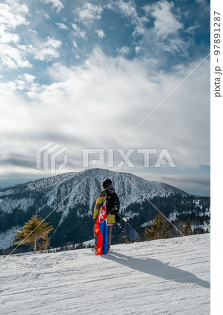 man snowboarder with slovakia flag at ski resort slope man snowboarder with slovakia flag at ski resort slope 97891287