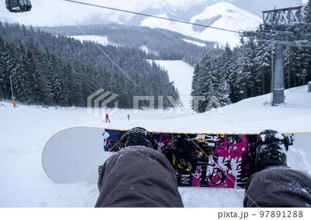 snowboarder point of view from the slope 97891288