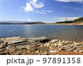 The Barcena reservoir with the chimneys of Compostilla thermal power station at background in Cubillos del Sil, el Bierzo, Castile and Leon, Spain. 97891358