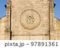 Rosette window in the facade of the Main Church of Our Lady of the Assumption in Caminha, Portugal. 97891361