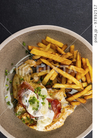 typical czech cuisine chicken slice baked with ham and camembert with french fries typical czech cuisine chicken slice baked with ham and camembert with french fries 97892517
