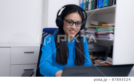 Young woman makes home office during Corona 97893524