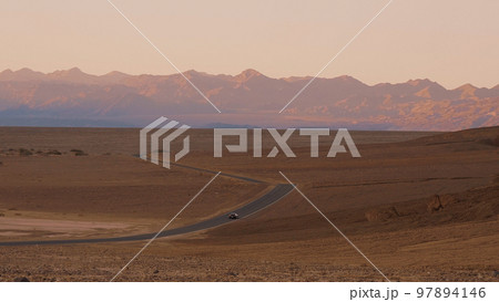 Lonesome street through Death Valley National Park in the evening Lonesome street through Death Valley National Park in the evening 97894146