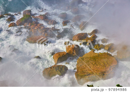Detail of Niagara Falls crashing into rocks below with mist Detail of Niagara Falls crashing into rocks below with mist 97894986