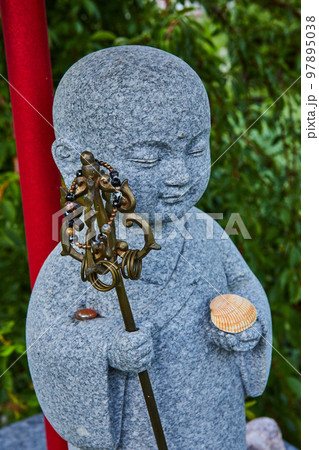 Detail of stone statue figure at Tibetan Mongolian Buddhist shrine Detail of stone statue figure at Tibetan Mongolian Buddhist shrine 97895038