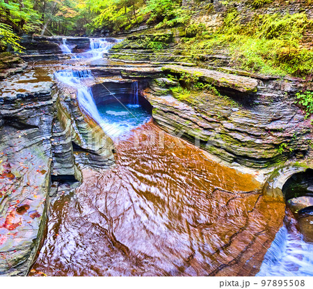 Beautiful wide panorama of waterfall from aerial view with layered rocks 97895508
