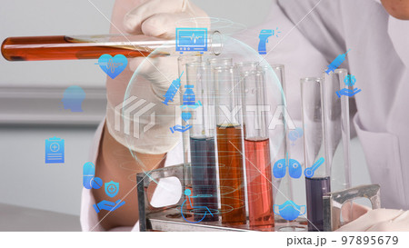 A lab tech mixing liquids. High quality 4k footage A lab tech mixing liquids. High quality 4k footage 97895679