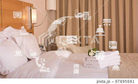 King sized bed in a luxury hotel room. High quality King sized bed in a luxury hotel room. High quality 97895681