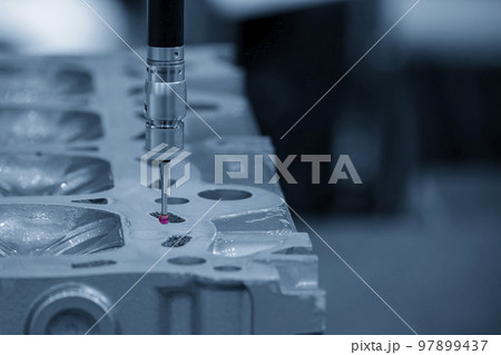 The  multi-axis CMM machine measuring the aluminum parts . 97899437