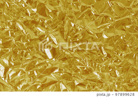 Gold foil leaf shiny texture, abstract yellow wrapping paper for background and design art work. Gold foil leaf shiny texture, abstract yellow wrapping paper for background and design art work. 97899628