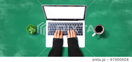 Person using a laptop computer Person using a laptop computer 97900608