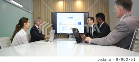 Successful business professionals team meeting report while working together with colleagues in the modern office. Successful business professionals team meeting report while working together with colleagues in the modern office. 97900751