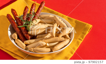 Spanish mini chorizo and picos on yellow 97902157