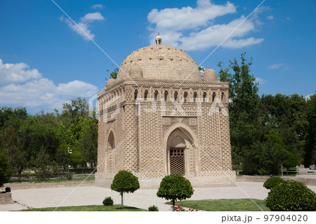 Samanid stone mausoleum in a park in Bukhara, Uzbekistan. Tourism, travel concept. 97904020