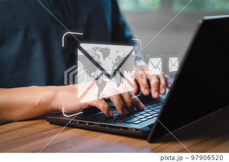 Man's hand using computer laptop and sending online message with email icon, email marketing concept, send email or newsletter, internet network working online. 97906520