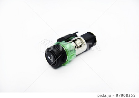 Cigarette lighter with green backlight. Spare part for the car. The electric cigarette lighter is disassembled. 97908355