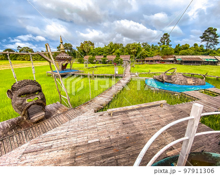 Sampaothai viewpoint, attraction park with a boat in rice fields, in Phattalaung, Thailand Sampaothai viewpoint, attraction park with a boat in rice fields, in Phattalaung, Thailand 97911306