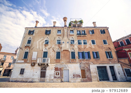 Old building with windows and chimneys Old building with windows and chimneys 97912689