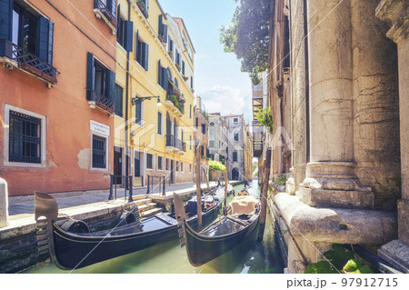 Gondols in Venice Italy in a small alley 97912715
