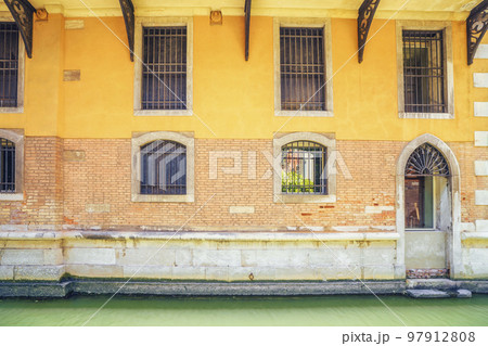 facade with windows covered with bars 97912808