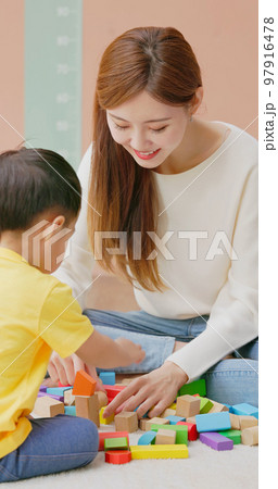 Family playing with building blocks Family playing with building blocks 97916478