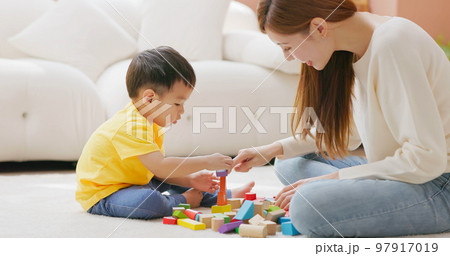 Family playing with building blocks 97917019