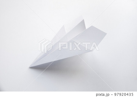 Paper plane origami isolated on a white background Paper plane origami isolated on a white background 97920435