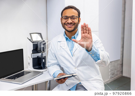 Male doctor in eye glasses looking positive and friendly 97920866