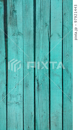 Close-up of bright emerald painted wooden fence 97921443