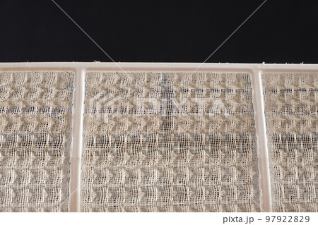 Dusty air conditioner filter. A lot of dust on the net, asthma and allergy to dust, cleaning of filters 97922829