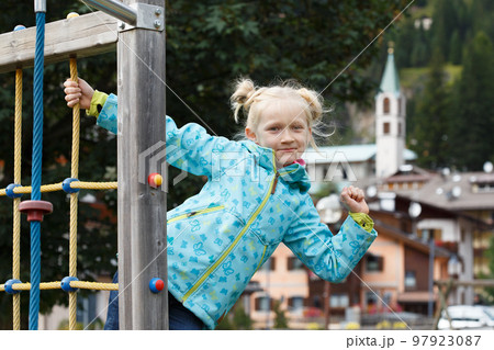smiling little girl at the playground 97923087