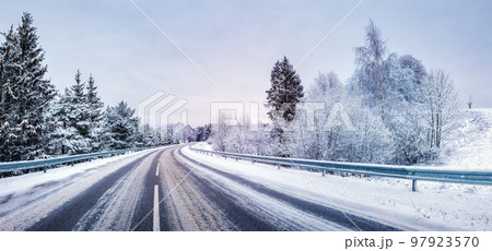 Sunset on the curvy highway in winter natural park 97923570