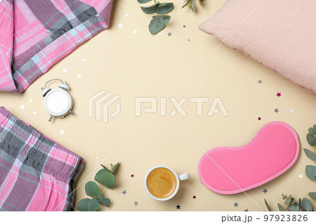 Flat lay composition with sleeping mask on yellow background, space for text. Bedtime accessories Flat lay composition with sleeping mask on yellow background, space for text. Bedtime accessories 97923826