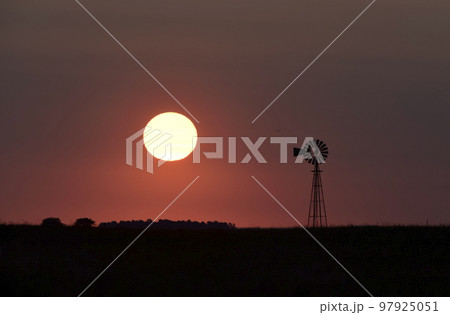 Windmill in countryside at sunset, Pampas, Patagonia,Argentina. Windmill in countryside at sunset, Pampas, Patagonia,Argentina. 97925051