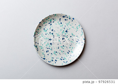 Top view of isolated of colored background empty round blue plate for food. Empty dish with space for your design Top view of isolated of colored background empty round blue plate for food. Empty dish with space for your design 97926531