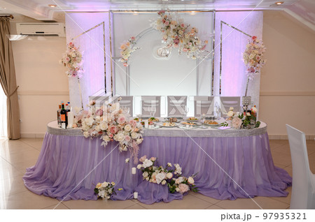 Festive table set with food and drinks. Festive table set with food and drinks. 97935321