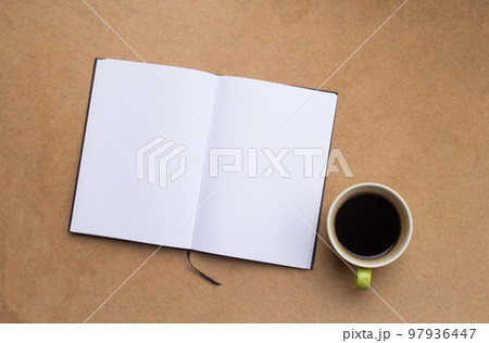 blank notebook and coffee with smartphone on wood table background. 97936447