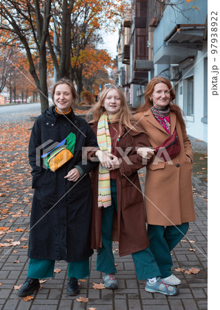 smiling mom and daughters 97938922