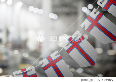 A garland of Faroe Islands national flags on an abstract blurred background A garland of Faroe Islands national flags on an abstract blurred background 97939965