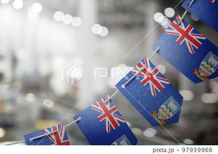 A garland of Falkland Islands national flags on an abstract blurred background 97939966