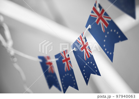 A garland of Cook Islands national flags on an abstract blurred background 97940063
