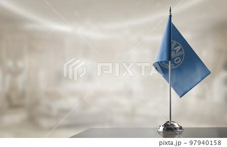 A small Food and agriculture organization flag on an abstract blurry background 97940158