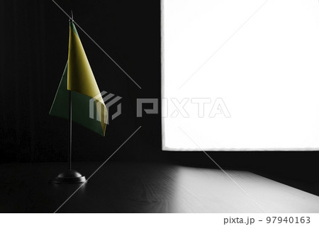 Small national flag of the French Guiana on a black background 97940163
